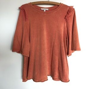 Rust colored swing tee from Anthropologie